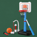 A children's toy basketball hoop set with a blue and black base, white backboard, red rim, orange basketball, white baseballs, a red pump, and a blue-and-white bat, arranged on a dark green background.