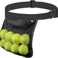 Black waist bag filled with tennis balls on a white background