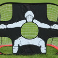 Soccer goal with a cartoon goalkeeper design on a grass field