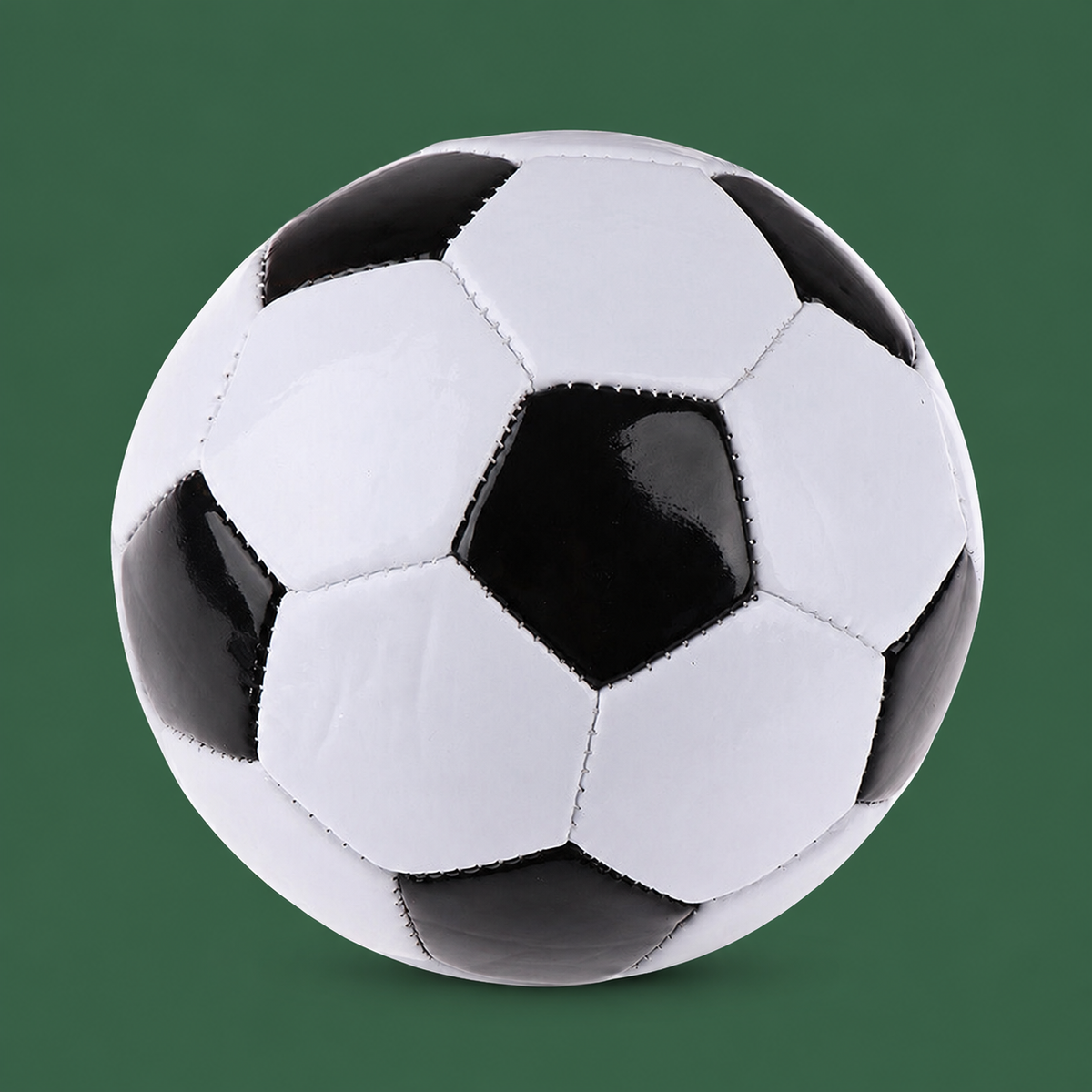Classic black and white size 5 soccer ball on Court District green