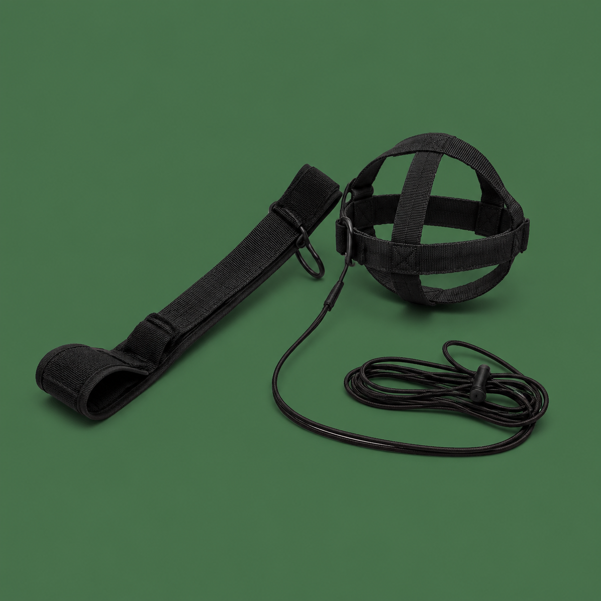 Black adjustable soccer kick trainer belt on green background