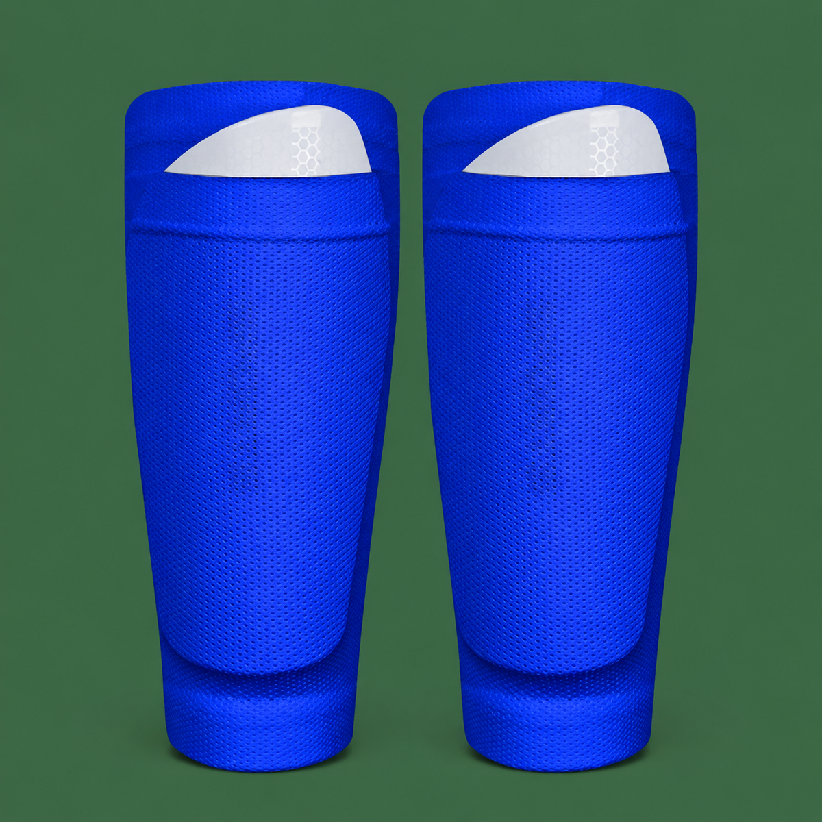 Blue soccer shin guard socks on green background