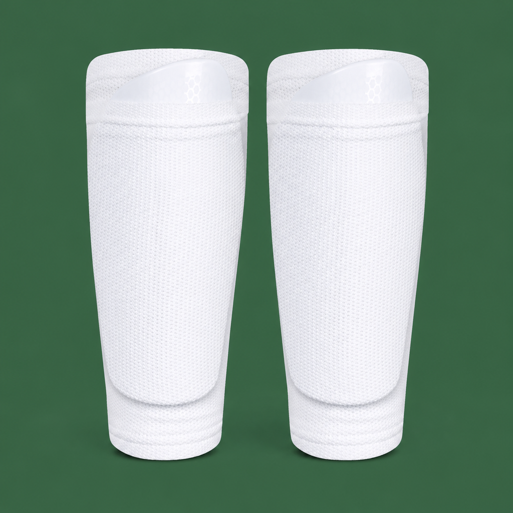 White soccer shin guard socks on green background