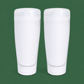 White soccer shin guard socks on green background