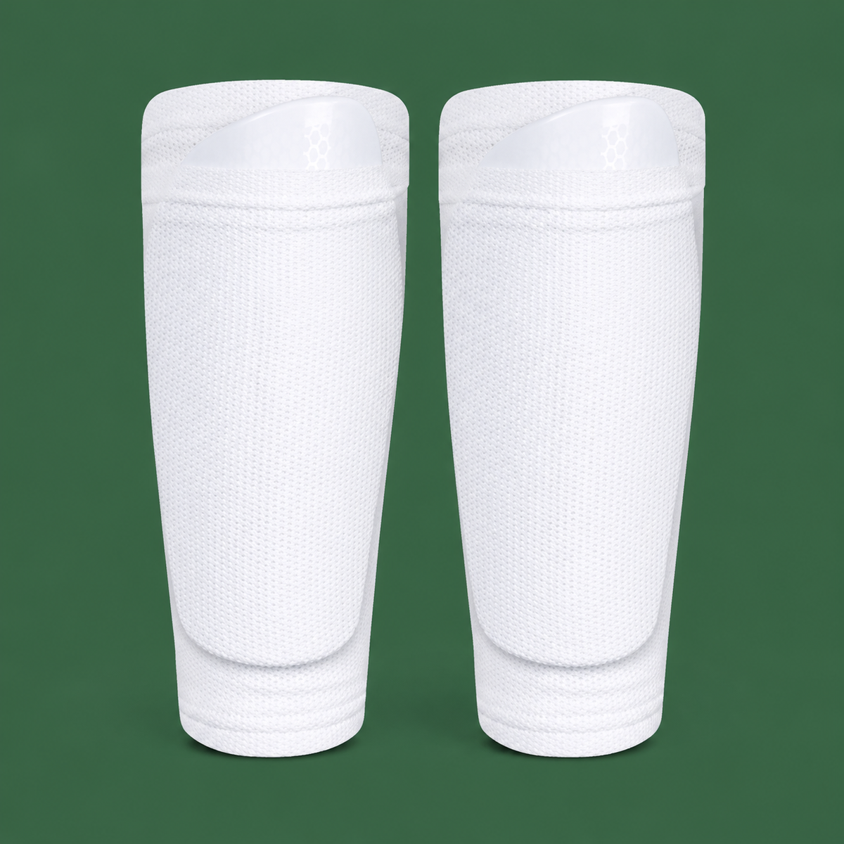 White soccer shin guard socks on green background