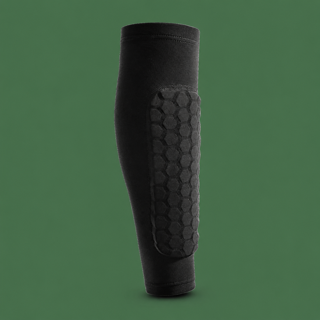 Breathable black soccer shin guard sleeve on Court District green background