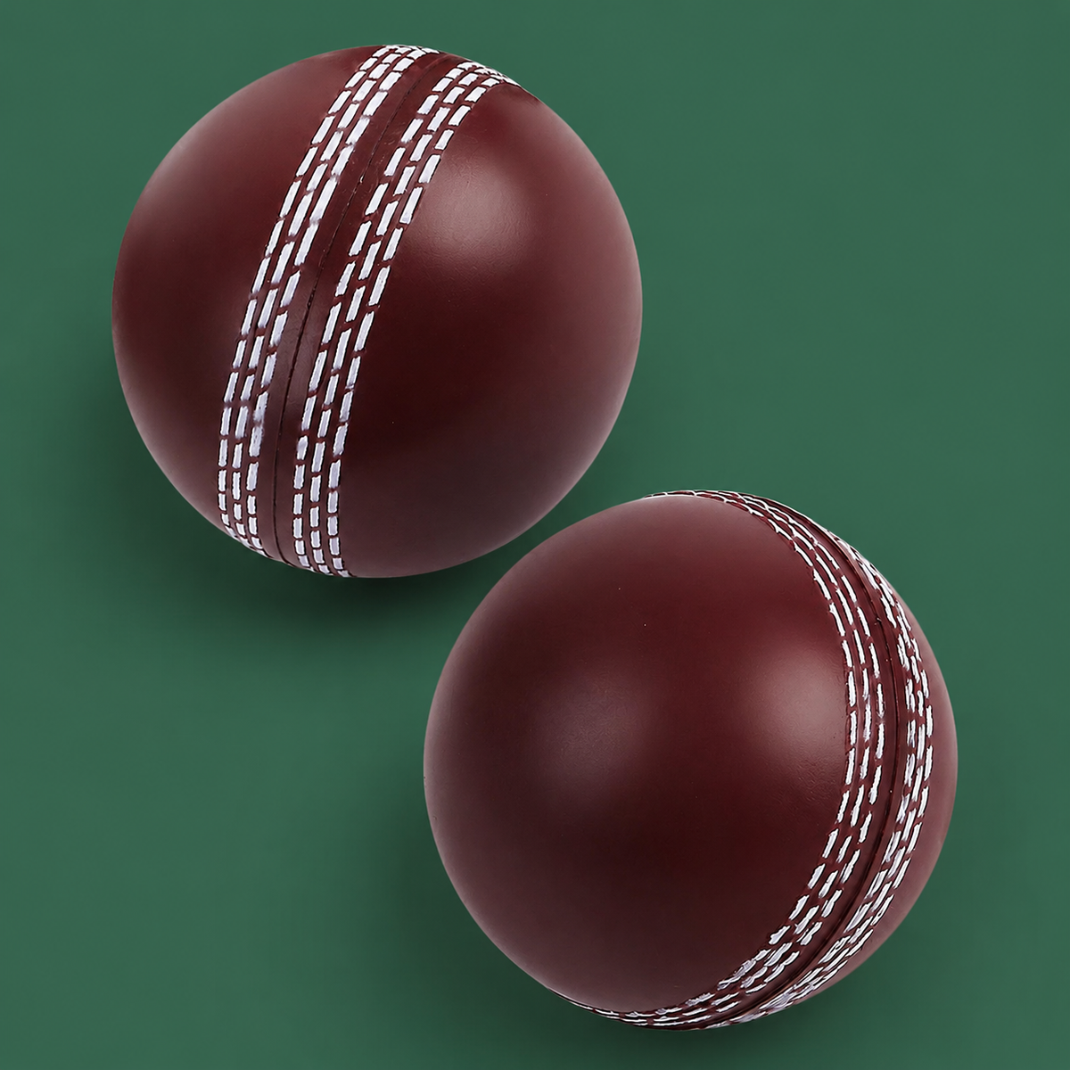 Soft indoor cricket training balls on Court District green background