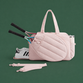 Pink women's tennis tote on Court District green background