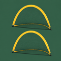Pair of Summit yellow pop-up soccer goals on Court District green